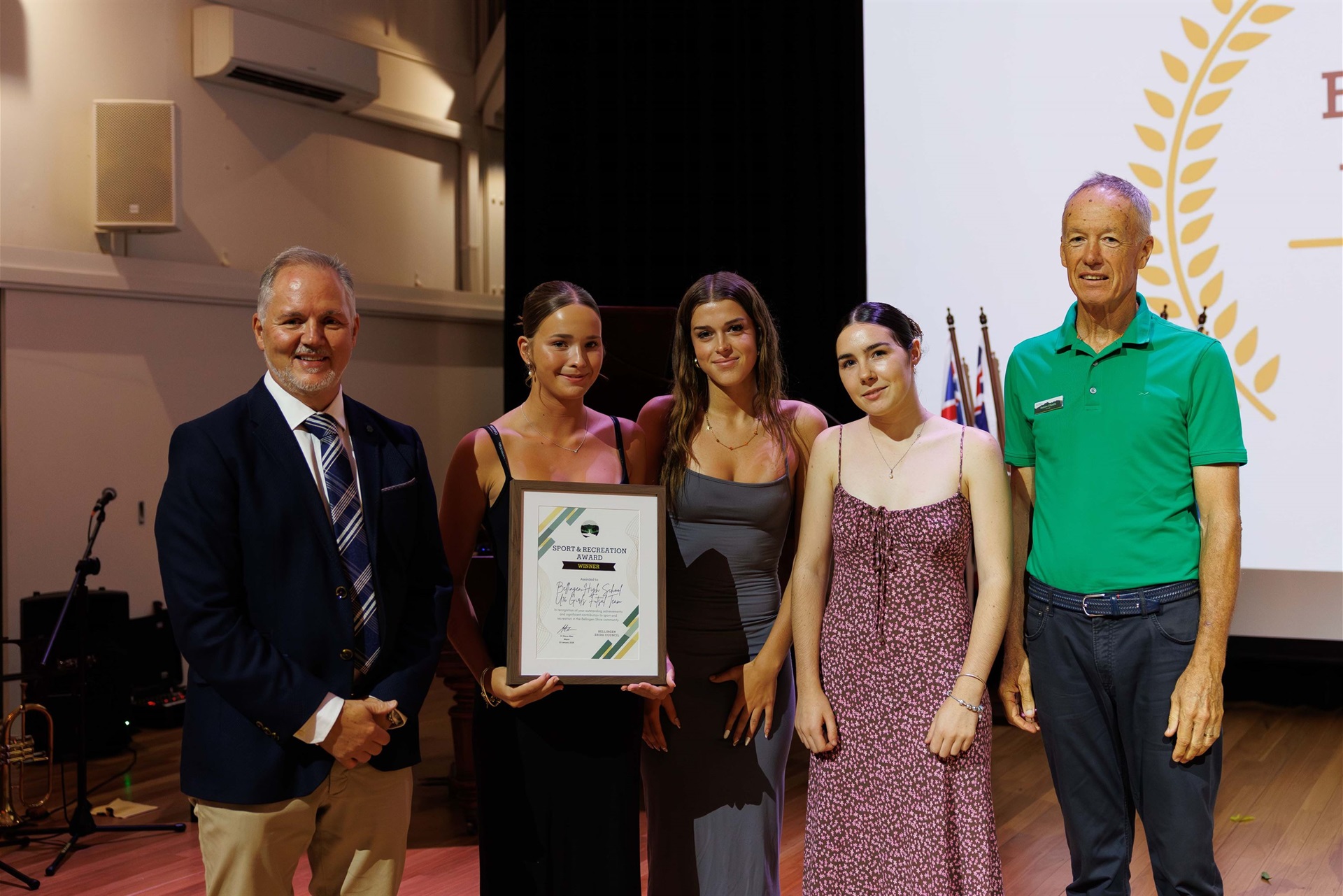 Mayor Cr. Steve Allan, Gracie Winfer, Pallas Gale & Bella Brodbeck accepting on behalf of the Bellingen High School U16 Girls Futsal Team, Cr. Andrew O'Keeffe